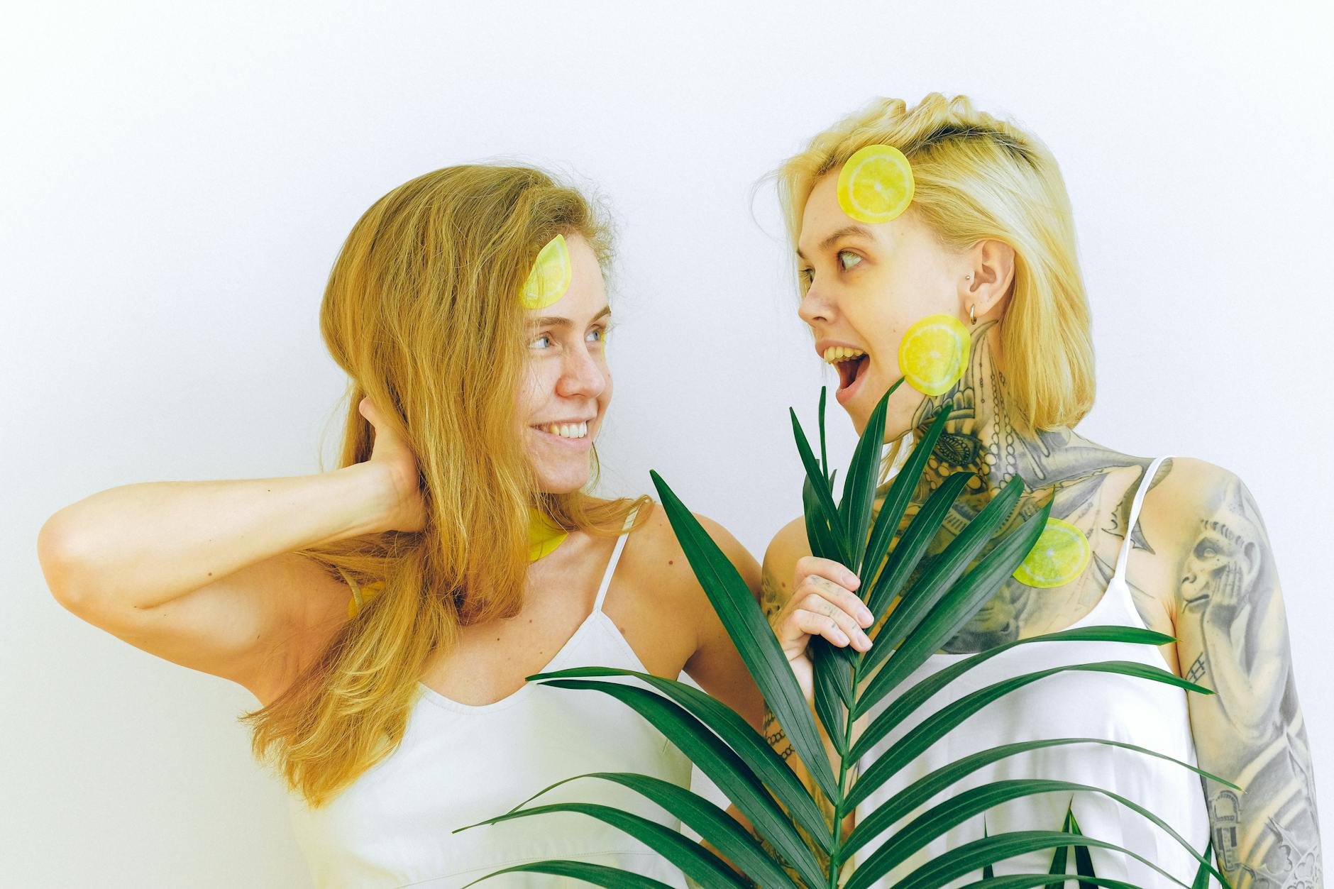 Two women smiling together, representing comfort and confidence around pleasure