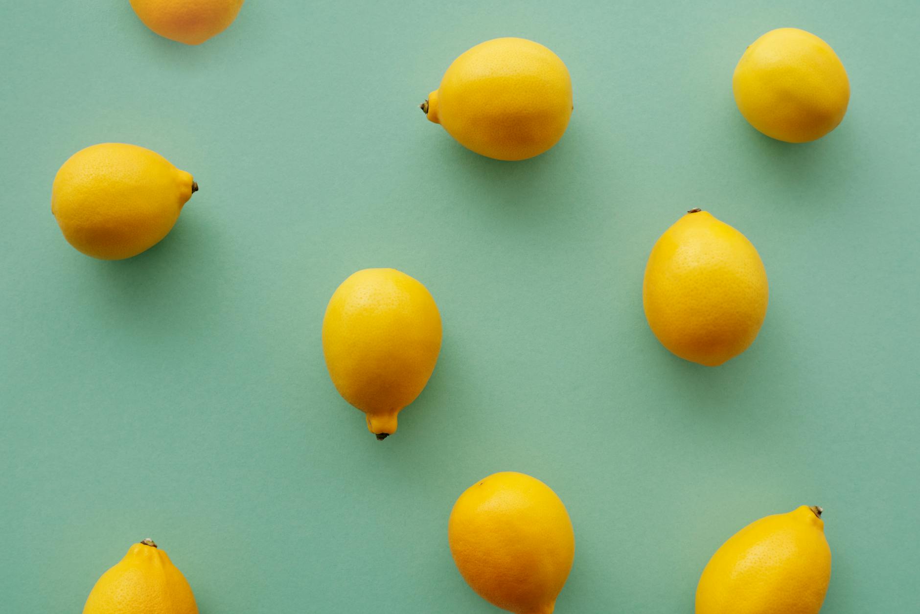 Bright yellow lemons on pastel background, symbolizing fresh approaches to intimate pleasure